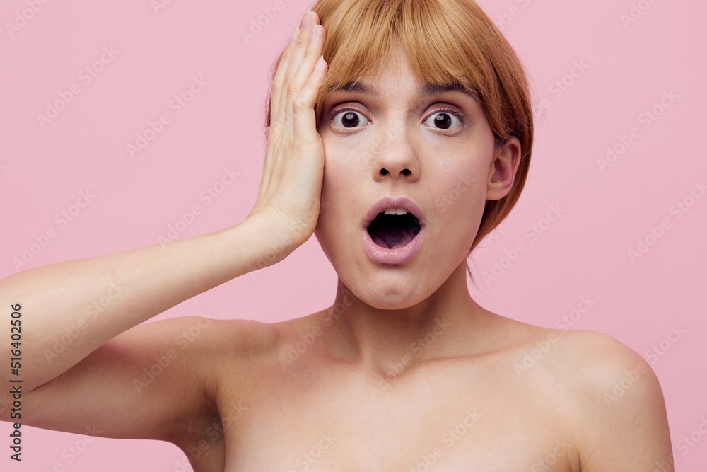 a close horizontal photo with an empty space of a shocked, surprised woman with perfect skin, standing on a pink background with her hands near her face with her mouth wide open a close horizontal photo with an empty space of a shocked, surprised woman with perfect skin, standing on a pink background with her hands near her face with her mouth wide open