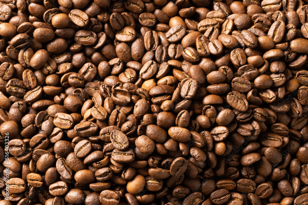 Image of close up of pile of roasting brown coffee beans Image of close up of pile of roasting brown coffee beans