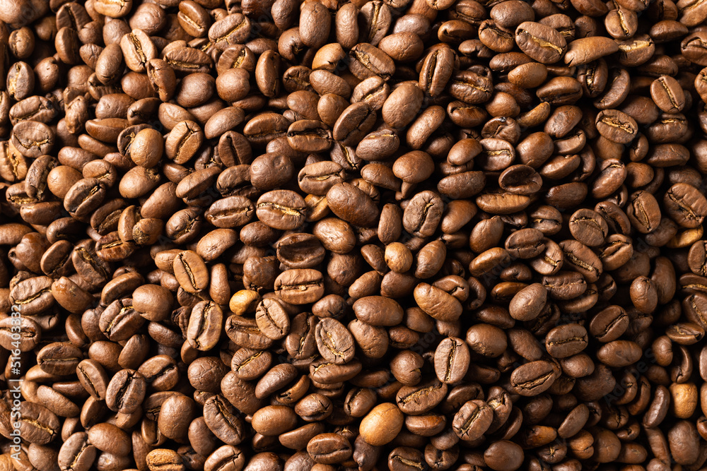 Image of close up of pile of roasting brown coffee beans Image of close up of pile of roasting brown coffee beans