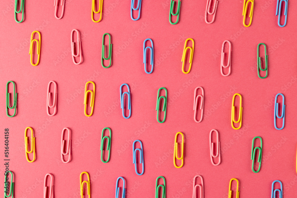 Composition of colorful clips on pin surface Composition of colorful clips on pin surface