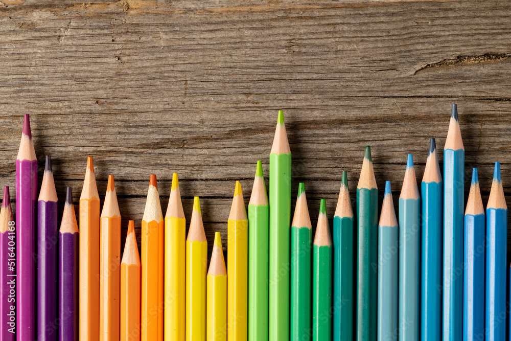 Composition of colorful crayons on wooden background Composition of colorful crayons on wooden background