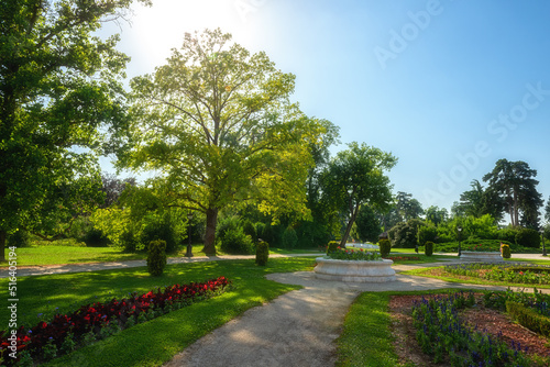 Beautiful garden of Festetics Palace with flowers and green grass and trees on a sunny summer day, Keszthely, Zala, Hungary. Outdoor travel background