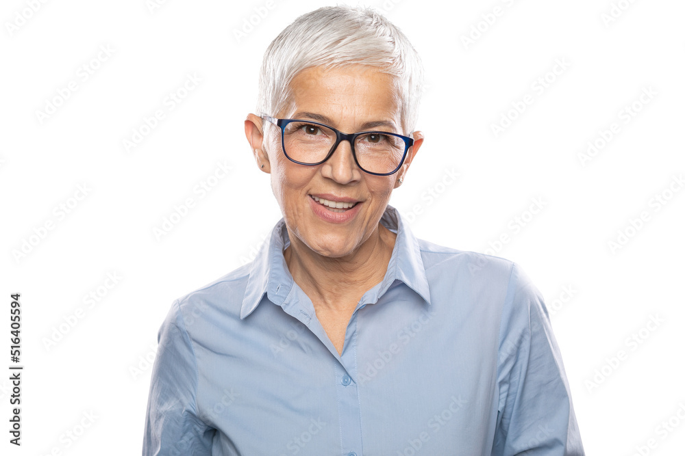 Smart senior Expert businesswoman with glasses in a blue shirt and gray white hair and glasses