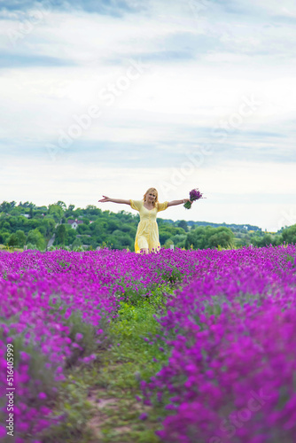Fototapeta Naklejka Na Ścianę i Meble -  Beautiful woman in lavender field. Selective focus.