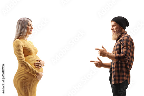 Profile shot of a bearded hipster guy talking to a pregnant woman