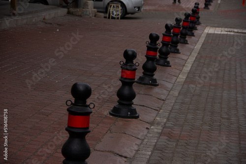 roadside red and black metal barriers