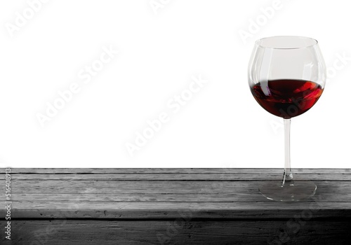 Red wine in a glass on light background