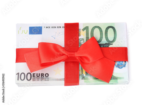 100 Euro banknotes with red ribbon isolated on white, top view. Money exchange