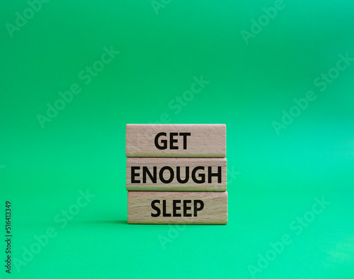 Get enough sleep symbol. Wooden blocks with words Get enough sleep. Beautiful green background. Healthy lifestyle, medical and Get enough sleep concept. Copy space.