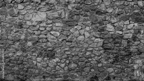 The view of the old stone wall is gray.