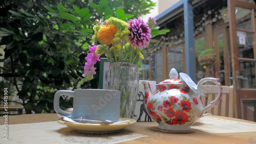 A photo of a tea service in a garden