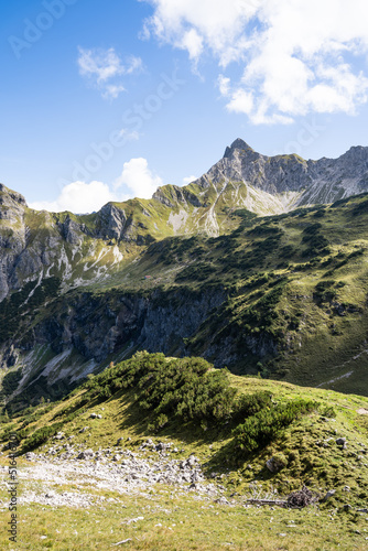 Hiking day in the Alps with a view over a valley