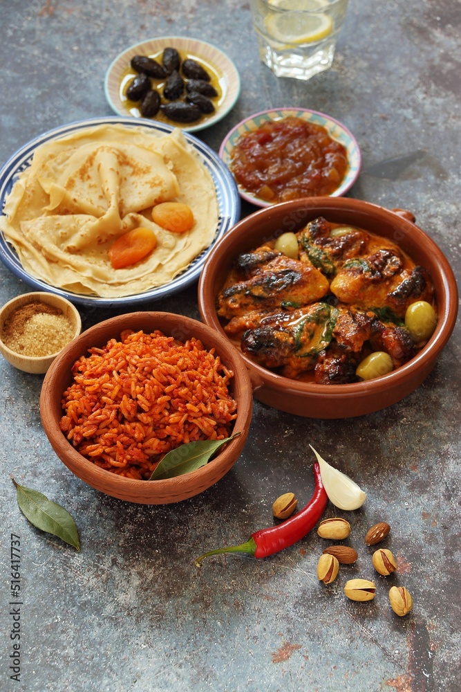 Jollof Rice. Traditional Nigerian spicy rice dish. National Jollof Rice day. Stock Photo Adobe