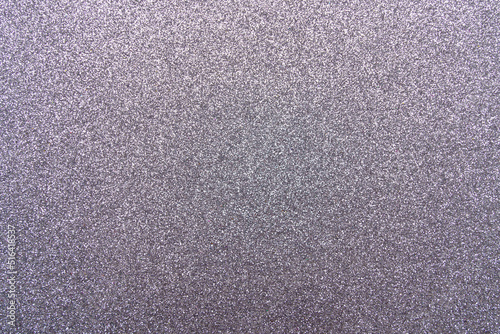 Background with sparkles. Backdrop with glitter. Shiny textured surface. Dark grayish violet photo