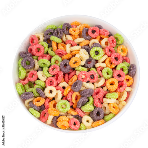 Delicious and nutritious fruit cereal loops multicolored flavorful on white background, healthy and funny addition to kids breakfast