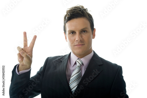 Young Businessman Makes Victory Sign Against White