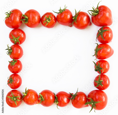 Photo of a ripe tomato on a white background in the form of a frame with a place for text.  product packaging design of tomato juice  pasta  croutons  chips.  Banner  signboard and background 