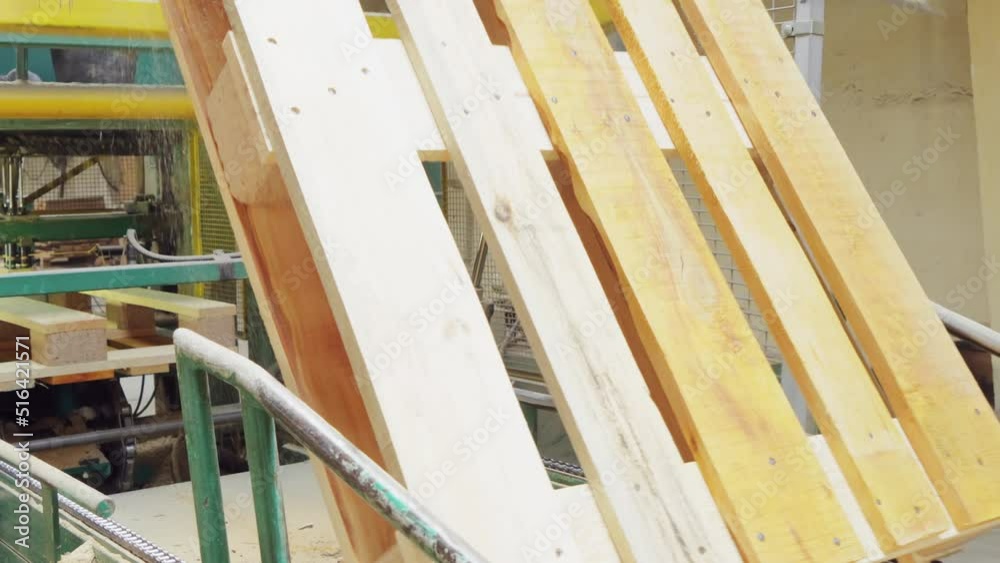 Production of ppiddons Industrial line at the enterprise. The pallet rotates with the help of equipment Woodworking industry Production of ppiddons Industrial line at the enterprise. The pallet rotates with the help of equipment Woodworking industry