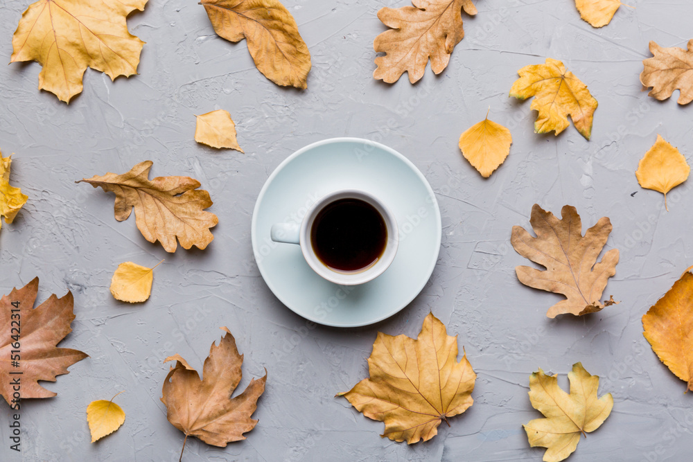 Flat lay composition with colorful Autumn cup of coffee and leaves on a color background. top view Flat lay composition with colorful Autumn cup of coffee and leaves on a color background. top view