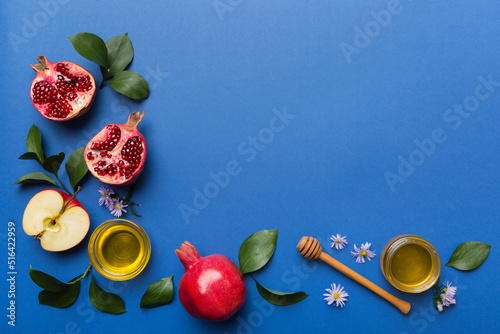 Vászonkép Flat lay composition with symbols jewish Rosh Hashanah holiday attributes on colored background, Rosh hashanah concept