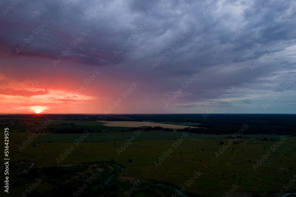 red sunset in storm clouds