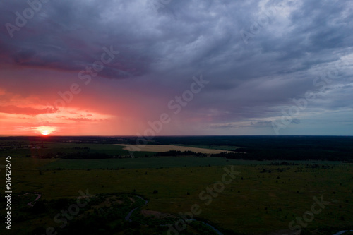 red sunset in storm clouds