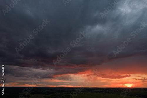 red sunset in storm clouds
