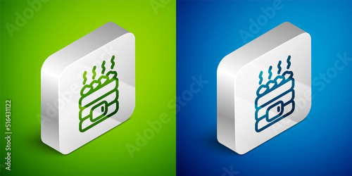 Isometric line Hot sauna stones icon isolated on green and blue background. Spa resort recreation, bathhouse relaxation. Hot stones on electric heater. Silver square button. Vector