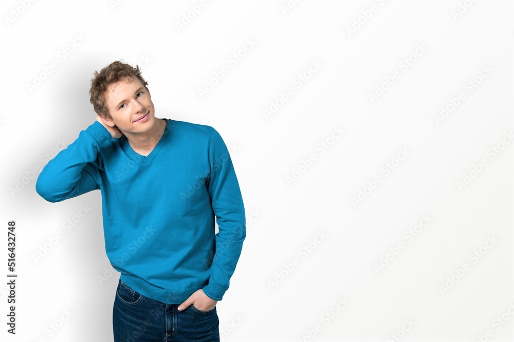 Handsome confident man dressed in stylish clothes. Fashion male posing Handsome confident man dressed in stylish clothes. Fashion male posing