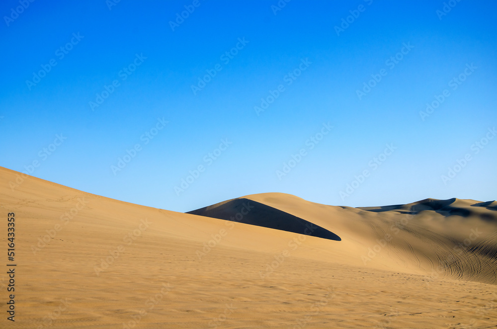 Sand desert with dune and blue sky - dunas de Ica, Huacachina, Peru