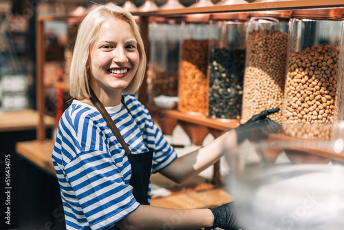 Konstfotografi Beautiful blonde woman working at health food store