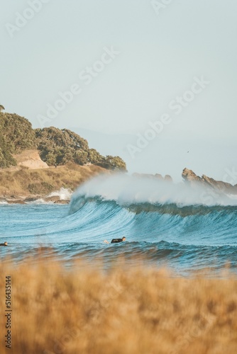 Photography Person big wave surfing near Mount Maunganui in New Zealand