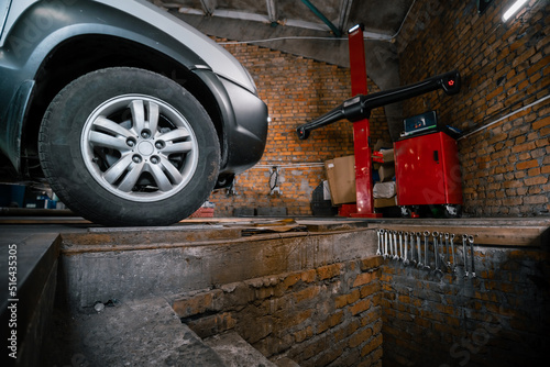 climbing camber  car service  adjusting the correct position of the wheels. pit.