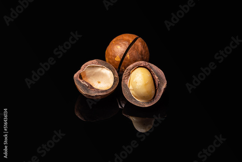 macadamia nuts on a black mirror background