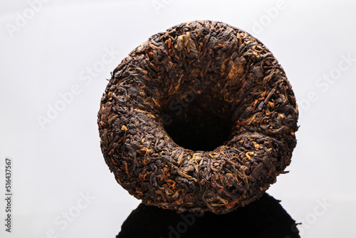 chinese  puer tea on black mirror background