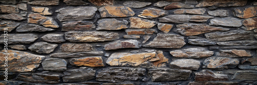 Stone wall. Wall of hewn wild stone. Stone background.