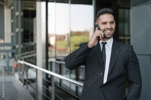 businessman using smartphone at street