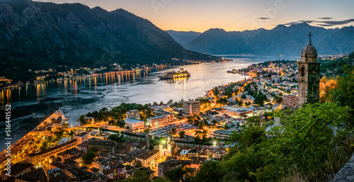 Panoramic evening view of the church, the old town and the Bay of Kotor from above. The Bay of Kotor is the beautiful place on the Adriatic Sea. Kotor, Montenegro. photo