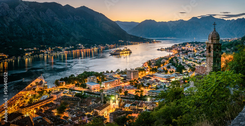 Panoramic evening view of the church, the old town and the Bay of Kotor from above. The Bay of Kotor is the beautiful place on the Adriatic Sea. Kotor, Montenegro.