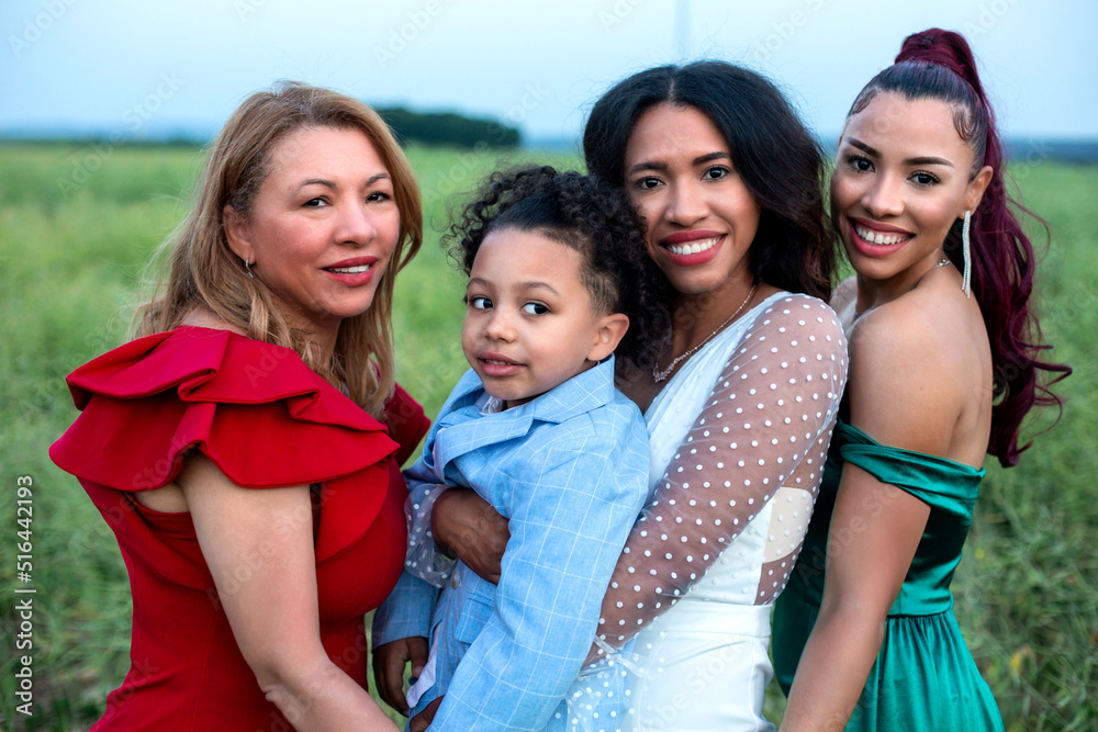 Obraz premium group of hispanic women with a boy outdoors
