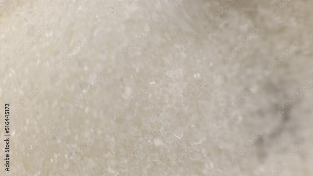 white crystal sugar in a teaspoon close-up macro white crystal sugar in a teaspoon close-up macro