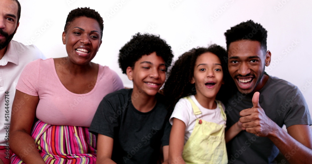 Obraz premium Black African family waving hello to camera, parent and kids talking to camera POV