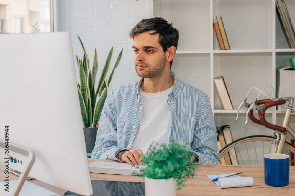 young man working at home with computer young man working at home with computer