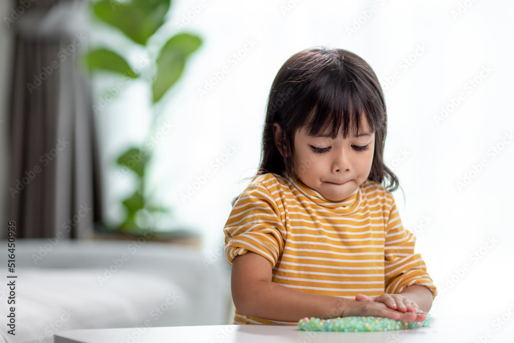 Kid play with handgum. Slime in children hands. Kid play with handgum. Slime in children hands.