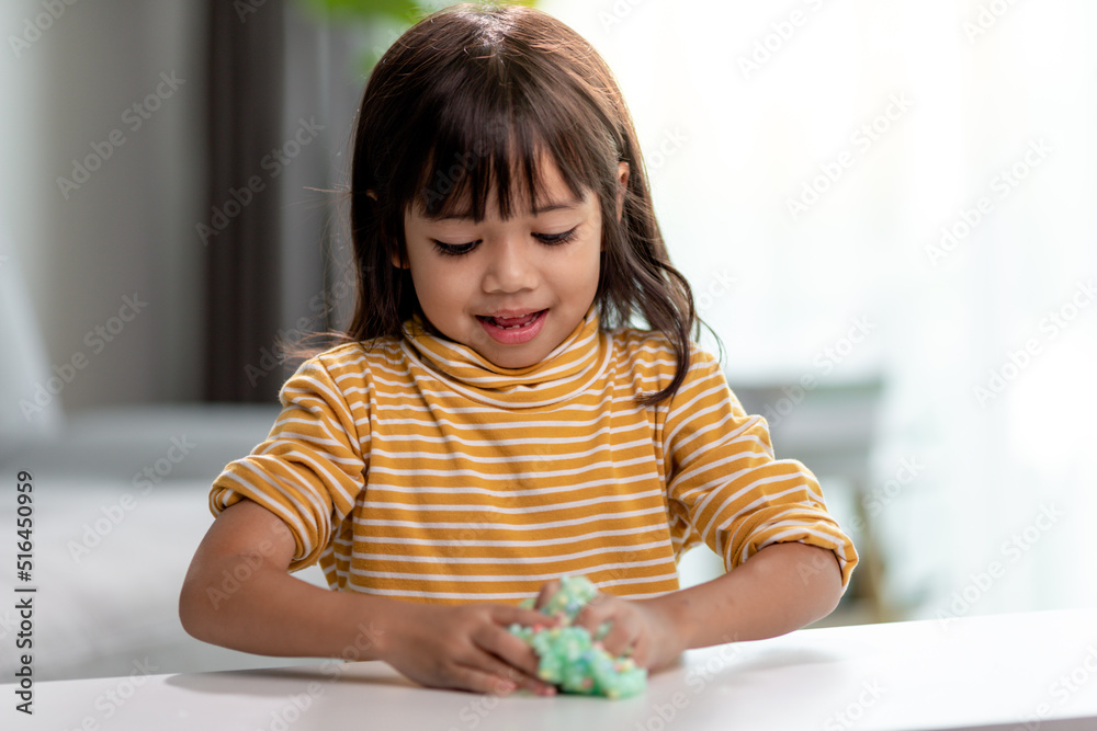 Kid play with handgum. Slime in children hands. Kid play with handgum. Slime in children hands.