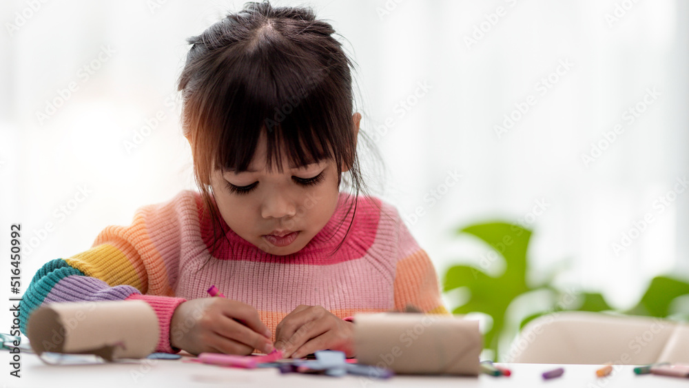 Little cute girl with painted tissue core. Art makes children learn and create. Little cute girl with painted tissue core. Art makes children learn and create.