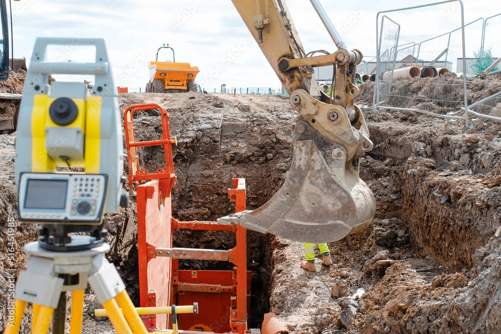 Deep drainage excavation works, with red trench support box installed ...
