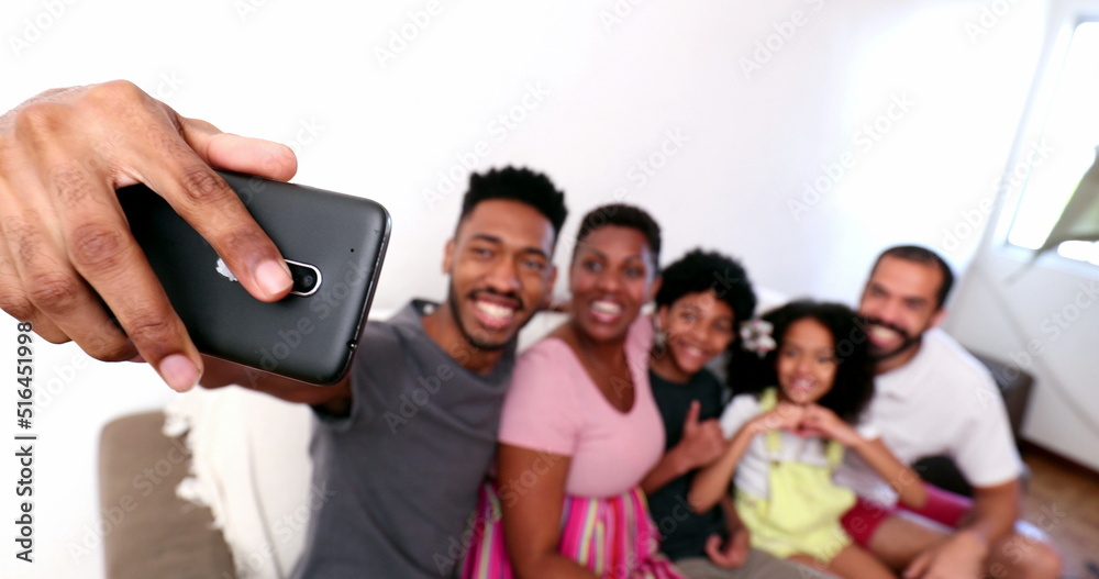 African family taking selfie photo with smartphone African family taking selfie photo with smartphone