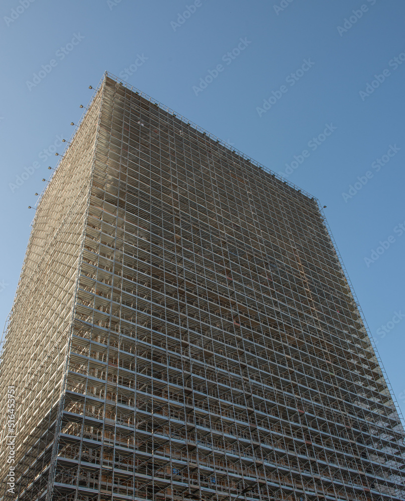 Building with scaffolding and protective sheets Building with scaffolding and protective sheets