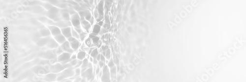 Water texture with sun reflections on the water overlay effect for photo or mockup. Organic light gray drop shadow caustic effect with wave refraction of light. Long Banner with copy space photo